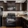 a kitchen with black appliances