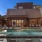a swimming pool in front of a house