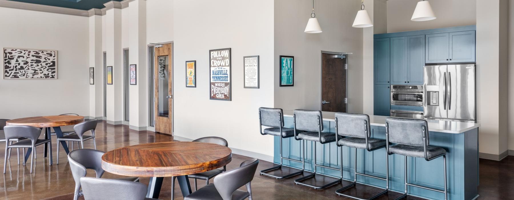 a kitchen with blue cabinets