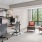 a room with a desk and chairs