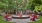 a courtyard with red chairs and a fountain in it