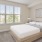 a bedroom with a large window