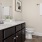 a bathroom with a sink toilet and mirror