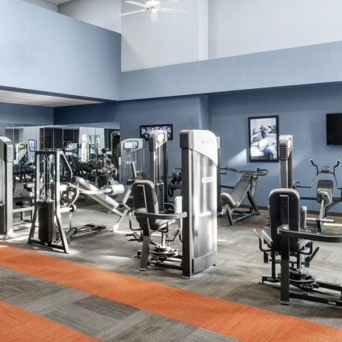 Cutting-edge amenities at your fingertips a gym with exercise equipment