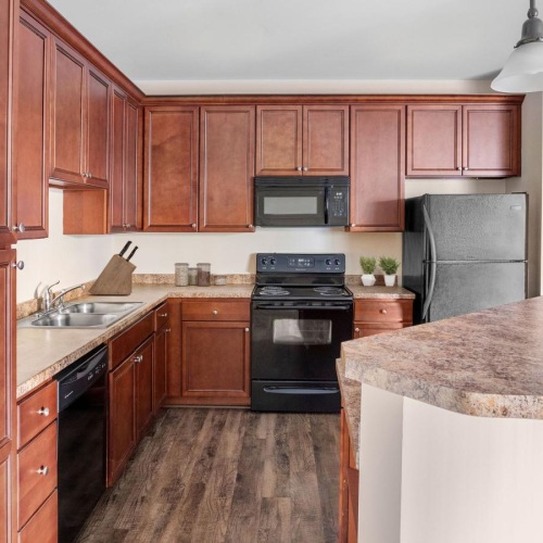 Spacious kitchens with thoughtful details a kitchen with wooden cabinets