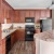 a kitchen with wooden cabinets