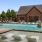 a swimming pool with a building in the background
