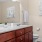 a bathroom with a sink toilet and a mirror