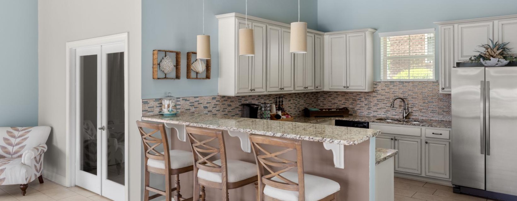 a kitchen with white cabinets