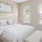 a bedroom with a bed and a lamp