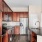 a kitchen with wooden cabinets
