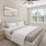 a bedroom with a bed and a fan
