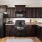 a kitchen with black appliances