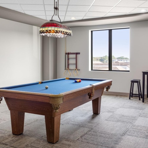 Take advantage of all Lenox Village Town Center has to offer a pool table in a room