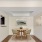a dining room with a table and chairs