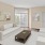 a living room with white furniture