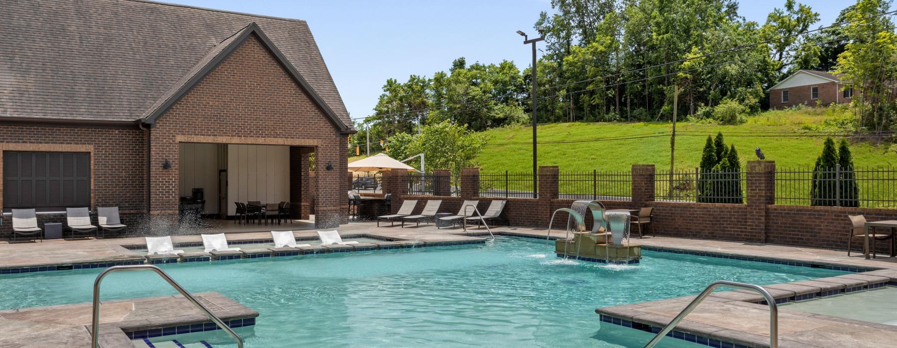 a swimming pool with a building in the background